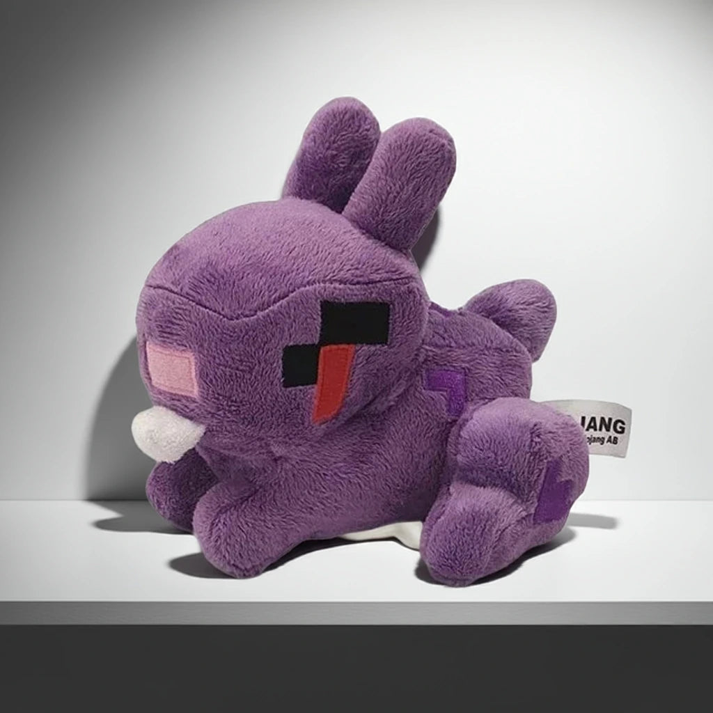 Purple plush toy with a white base on a gray background